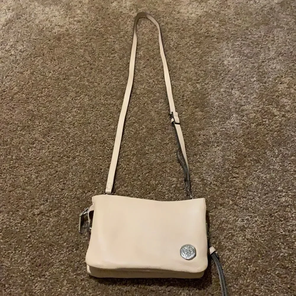 Vince Camuto soft pink crossbody wristlet.